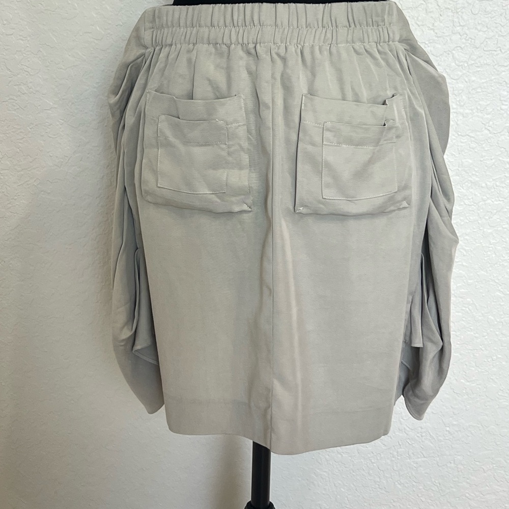 Adam Beige Button-Front Mini Skirt
Caja 7 - Picture 2 of 5